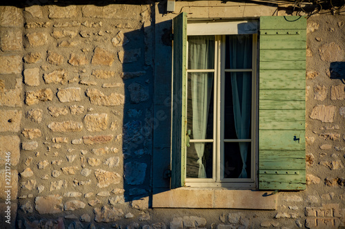 View on window in medieval house in Provence in sun lights, South of France