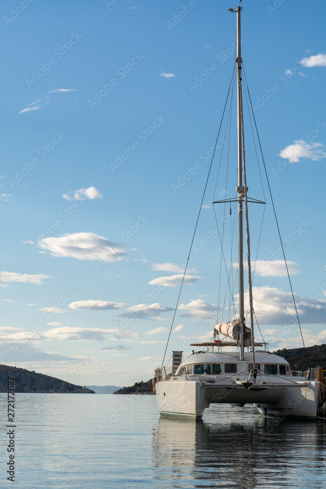 Seascape with big white catamaran yacht boat, vacation destination