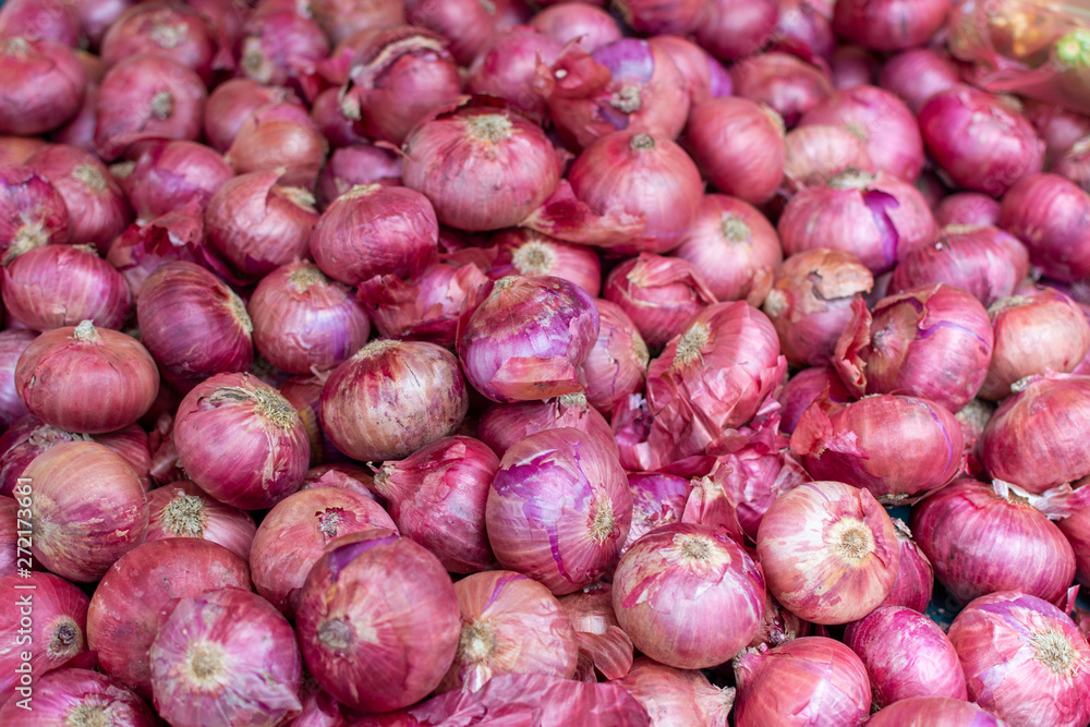 Young fresh red onion on market, new harvest, close up Young fresh red onion on market, new harvest, close up