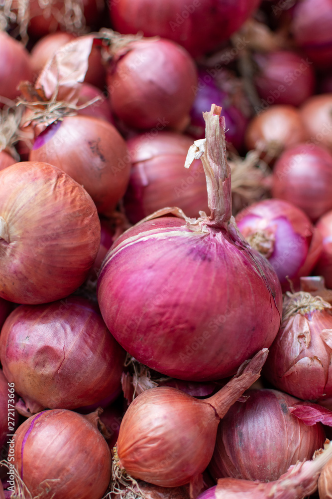 Young fresh red onion on market, new harvest, close up Young fresh red onion on market, new harvest, close up
