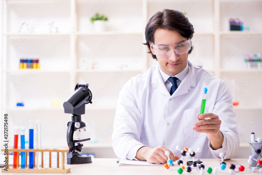 Young male scientist working in the lab Young male scientist working in the lab