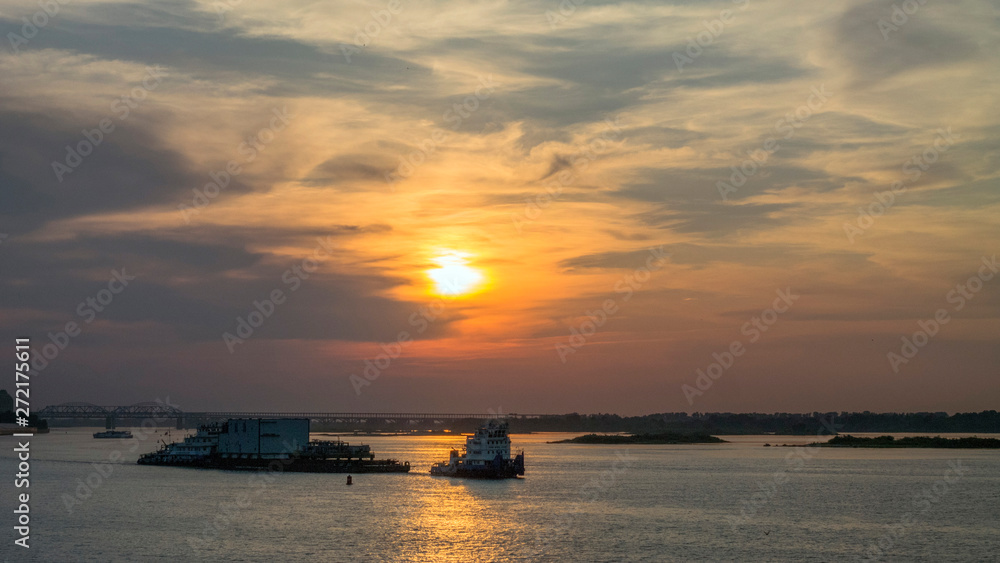 sunset river Volga tow