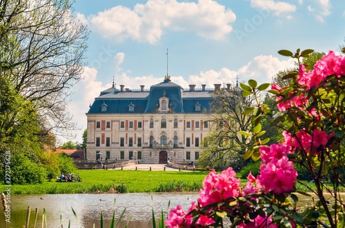 Beautiful historic castle in colorful spring scenery. Neo baroque castle in a park in Pszczyna in Poland.