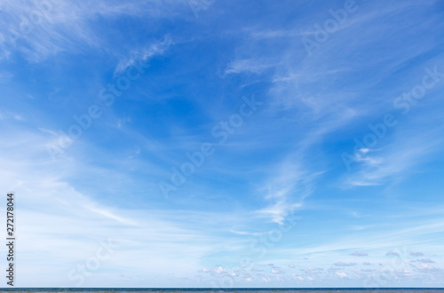 Photography Beautiful blue sky over the sea with translucent, white, Cirrus clouds