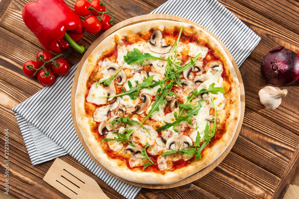 Italian Delicious Fresh Hot Mix Baked Pizza with Melting Cheese, sliced mushrooms , tomato sauce and cheddar serving on textured rustic background. Mushrooms pizza. top view. Italian Delicious Fresh Hot Mix Baked Pizza with Melting Cheese, sliced mushrooms , tomato sauce and cheddar serving on textured rustic background. Mushrooms pizza. top view.