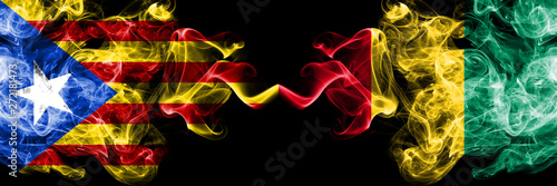 Catalonia vs Guinea  Guinean smoke flags placed side by side. Thick colored silky smoke flags of Catalonia and Guinea  Guinean