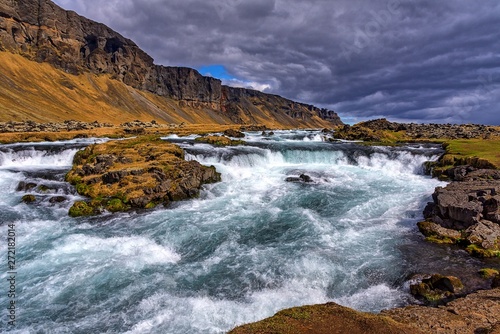 Waterfall on the side of the road in Iceland