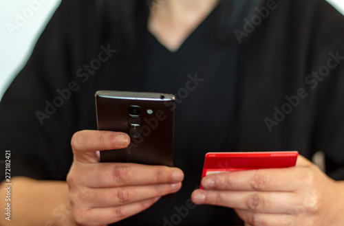 Women hands making online payment with smarthphone