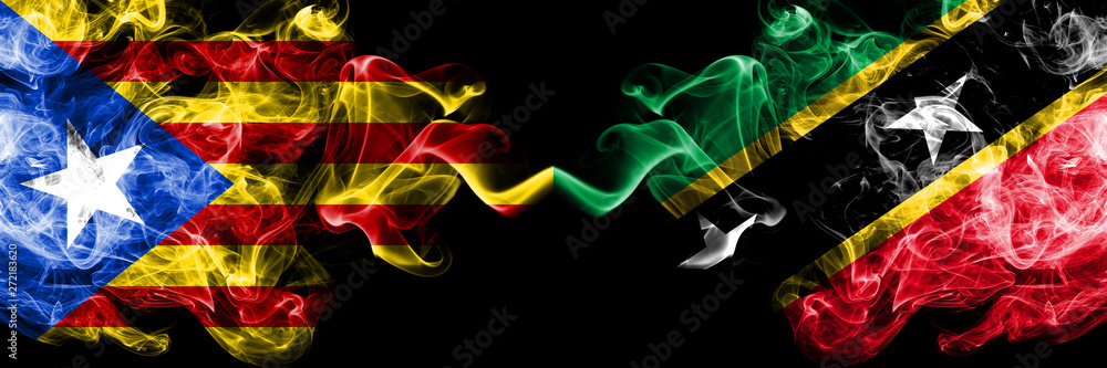 Fototapeta Catalonia vs Saint Kitts and Nevis smoke flags placed side by side. Thick colored silky smoke flags of Catalonia and Saint Kitts and Nevis
