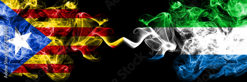 Catalonia vs Sierra Leone smoke flags placed side by side. Thick colored silky smoke flags of Catalonia and Sierra Leone