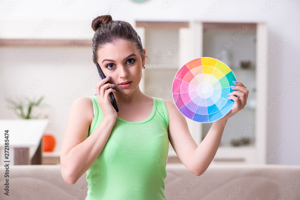 Young beautiful woman doing renovation at home Young beautiful woman doing renovation at home