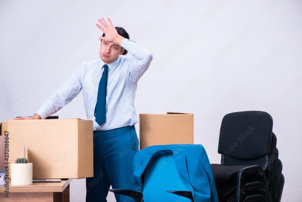 Young handsome businessman being fired from his work 