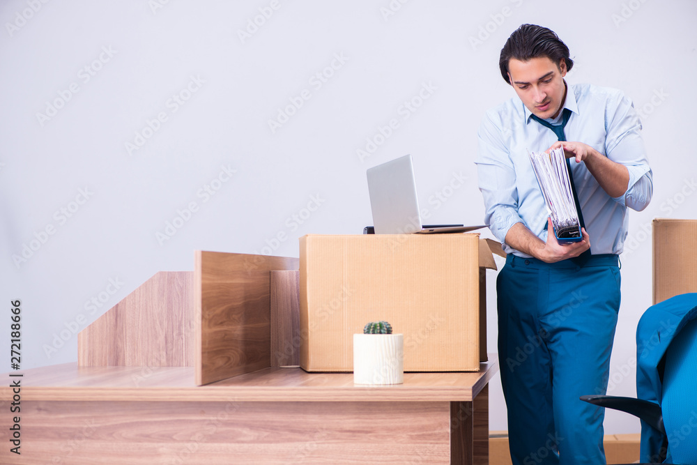 Young handsome businessman being fired from his work Young handsome businessman being fired from his work