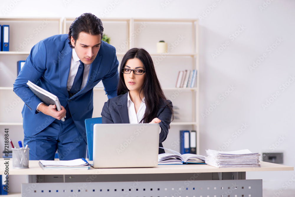 Fototapeta premium Two employees working in the office 