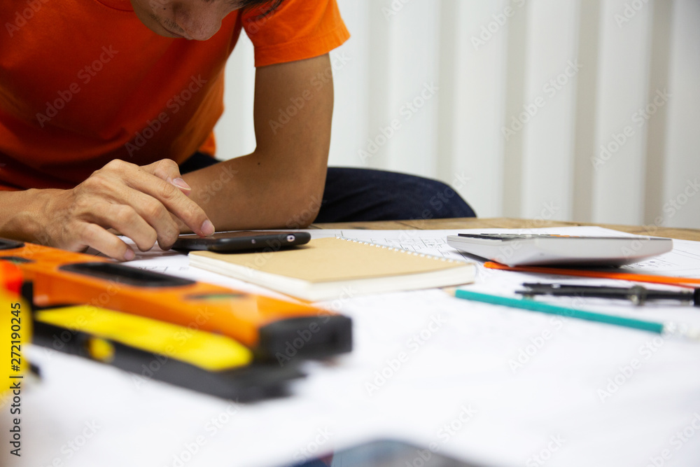 Architect Designing in blueprint at Construction Site With drawing equipment.concept Architect Designing in blueprint at Construction Site With drawing equipment.concept