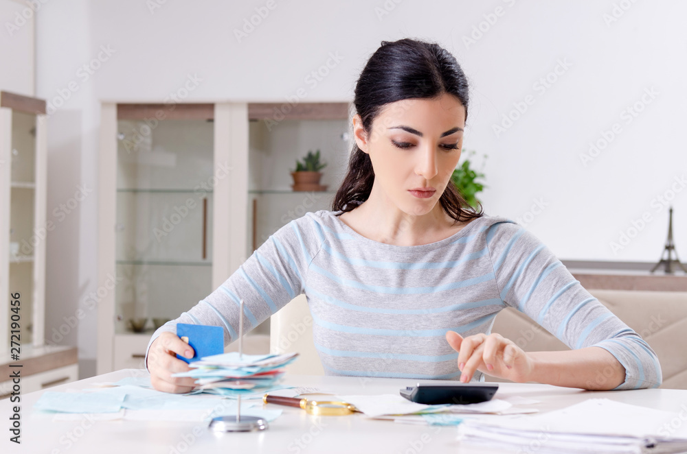 Young woman in budget planning concept Young woman in budget planning concept