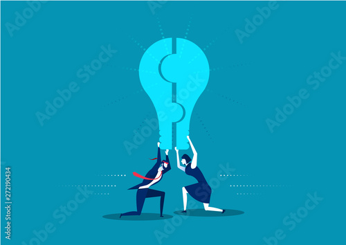 business man and woman holding a puzzle,Form a light bulb. Isolated on blue background.