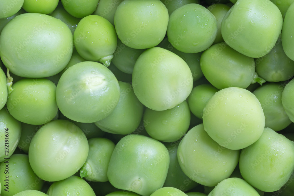 close up of green uncooked peas background close up of green uncooked peas background