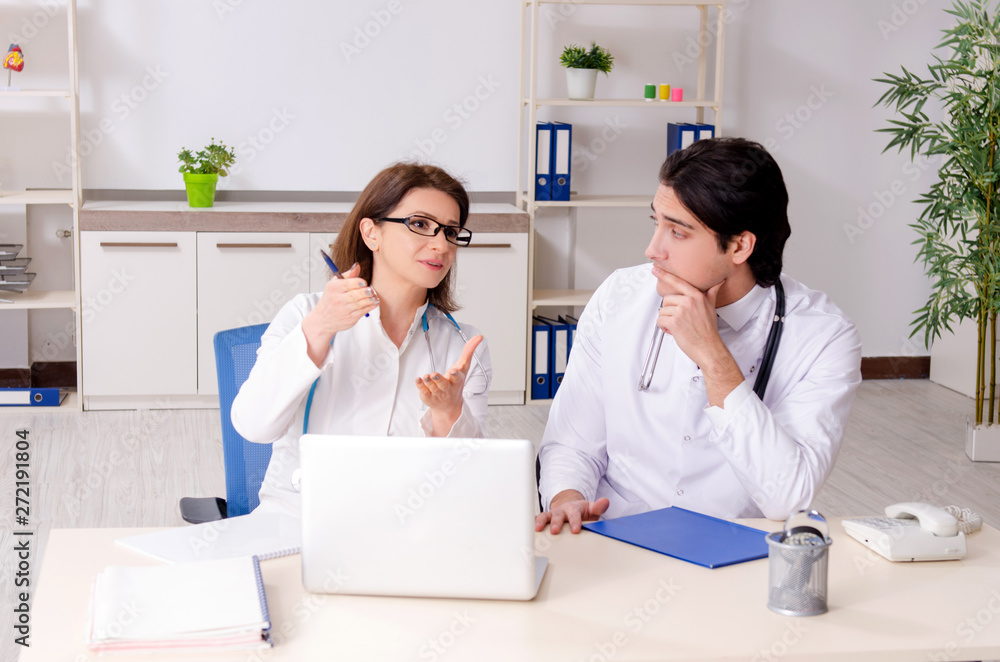 Two doctors working in the clinic Two doctors working in the clinic