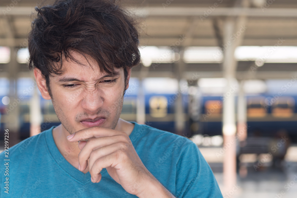 Fotografie man smelling bad odor, something stinks