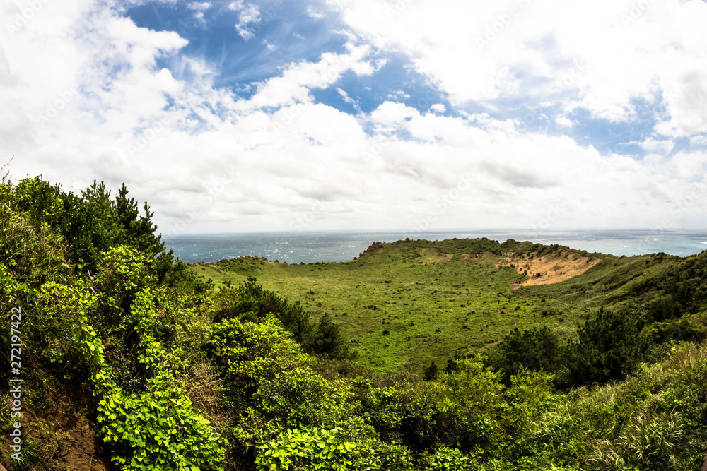 Obraz premium Seongsan Ilchulbong beautiful volcano island rises from the sea in the East of Jeju South Korea Asia