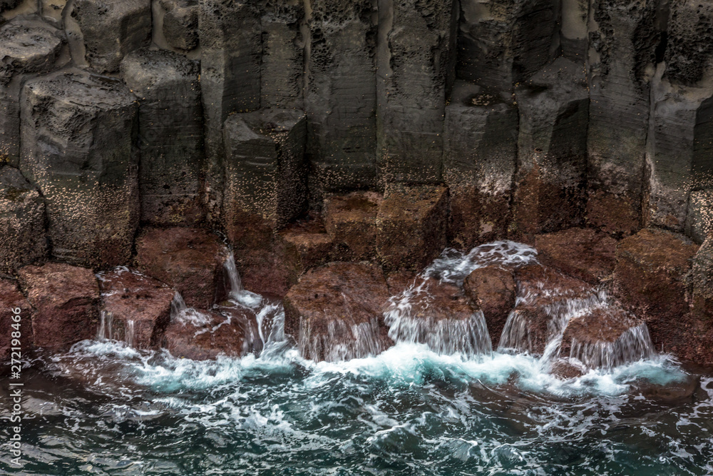Obraz premium Volcanic pillar cliff near sea shore seaside in Jusangjeolli Seogwipo Jeju South Korea