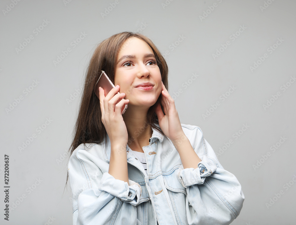 Portrait of beautiful cheerful woman talking on mobile phone Portrait of beautiful cheerful woman talking on mobile phone