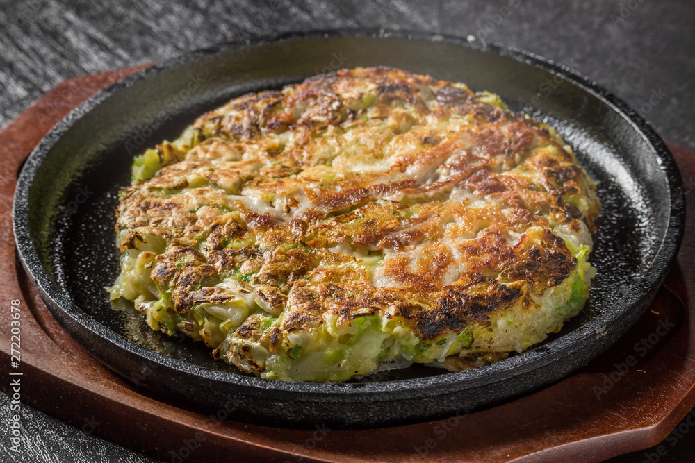 お好み焼き Okonomiyaki is a Japanese-style pancake お好み焼き Okonomiyaki is a Japanese-style pancake