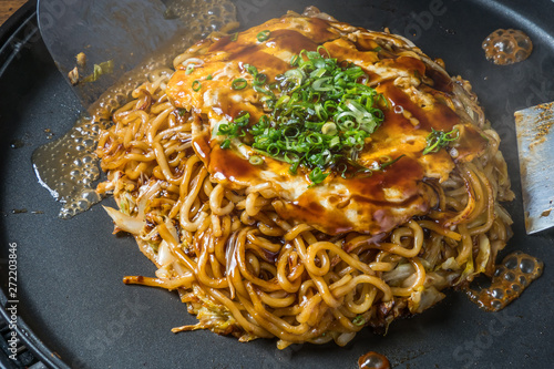 お好み焼き  Okonomiyaki is a Japanese-style pancake photo