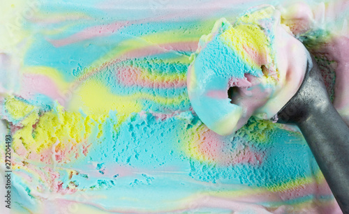 Fototapeta Naklejka Na Ścianę i Meble -  Closeup scooping ice cream Rainbow colorful, Top view Blank for design..