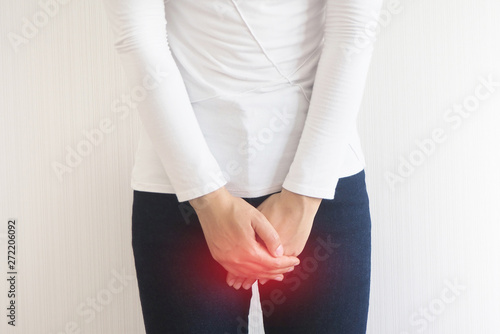 Bild auf Leinwand Cystitis in asian woman and hand holding pressing her crotch lower abdomen case of abdominal pain with isolated on white background using for health care concept