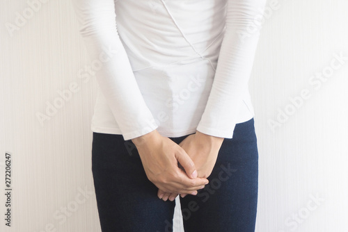Valokuva Cystitis in asian woman and hand holding pressing her crotch lower abdomen case of abdominal pain with isolated on white background using for health care concept