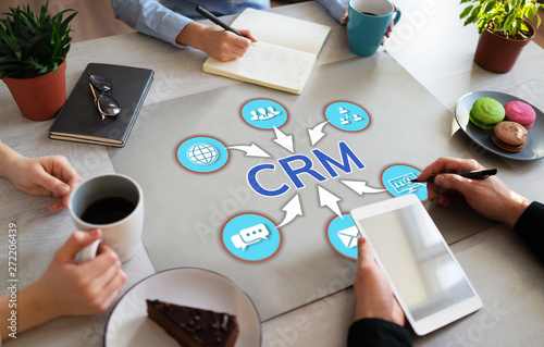 CRM Customer relationship management concept on office desktop. photo