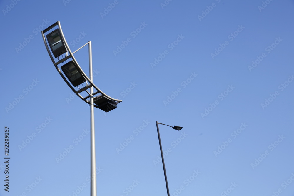 Obraz premium Modern street lamp in blue sky.