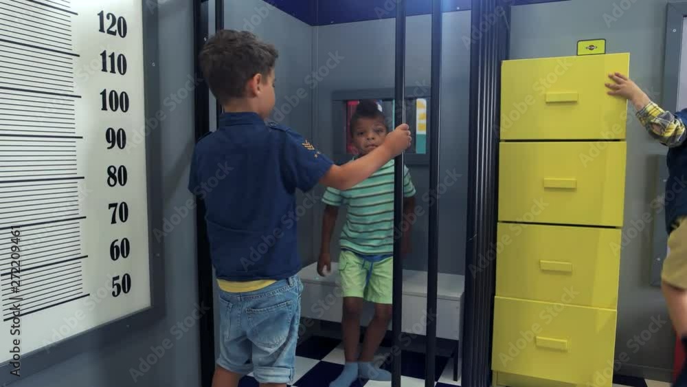 Little boys playing police and thief indoor. Role play at the game center for children. Little boys playing police and thief indoor. Role play at the game center for children.