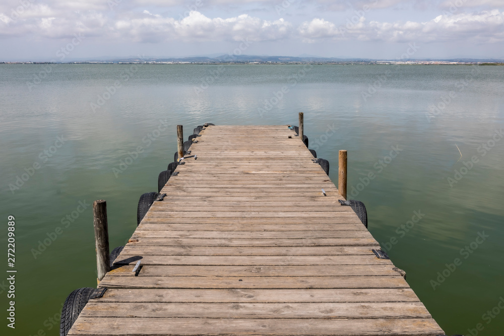 Fototapeta premium A Dock By The Lake At morning Sky