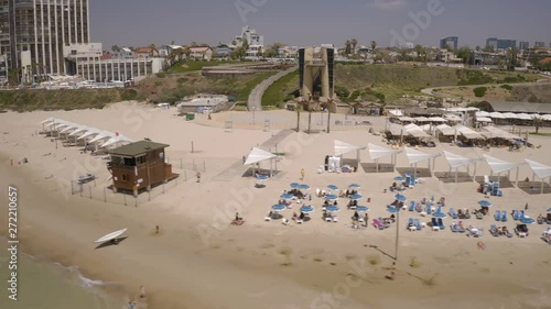 Herzliya beach with umbrellas, Israel, 4k aerial drone view photo