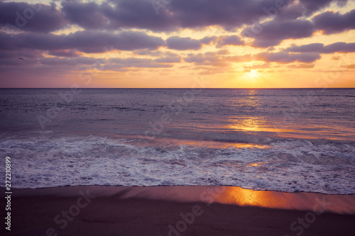 Fototapeta Naklejka Na Ścianę i Meble -  Sunset over the sea. Atlantic ocean in the evening. Nazare, Portugal, Europe