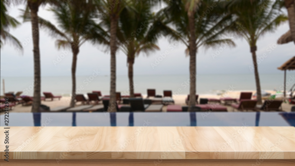 Wood table top and blurred summer beach background