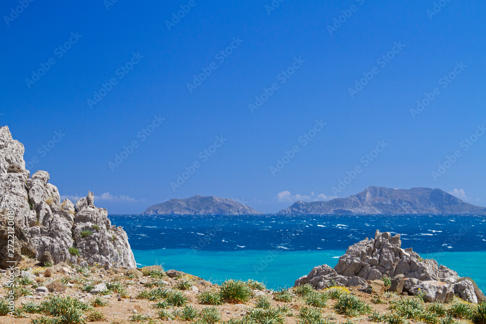 View over the blue mediterranean sea on the uninhabited Paximadia Islands from the coast of Crete, near Aghios Pavlos