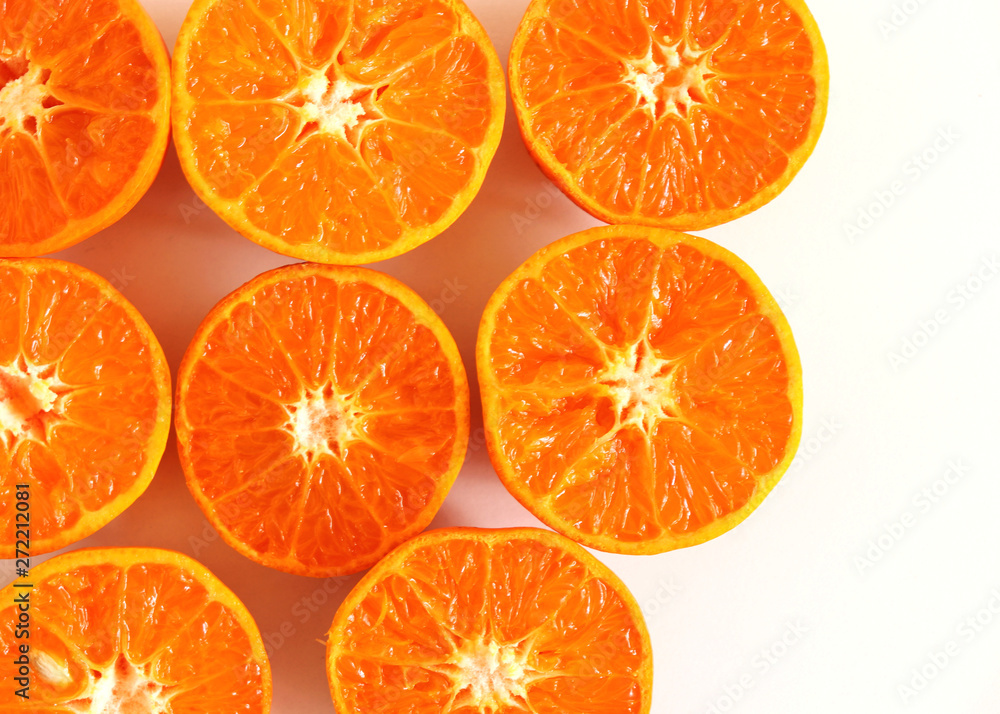 Tropical exotic fruit . Tangerines slices isolated on white table background. Summer food concept. Flat lay, top view Tropical exotic fruit . Tangerines slices isolated on white table background. Summer food concept. Flat lay, top view