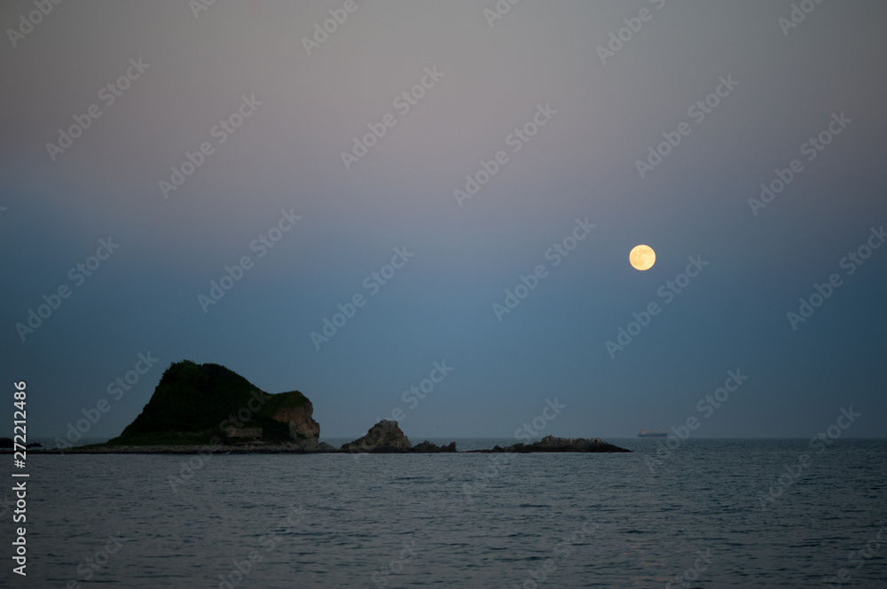 Full moon in a cloud and the sea beautiful night. Full moon in a cloud and the sea beautiful night.
