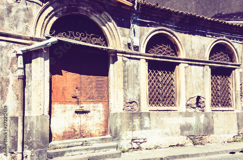 Sicily  entrance door on facade of old baroque building in Catania  traditional architecture of Italy.