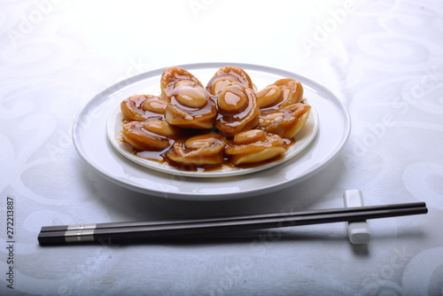 wide spread of abalone servings in a fine dining setting