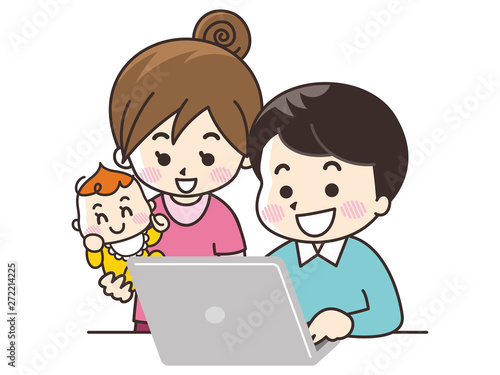 ノートパソコンを見る家族