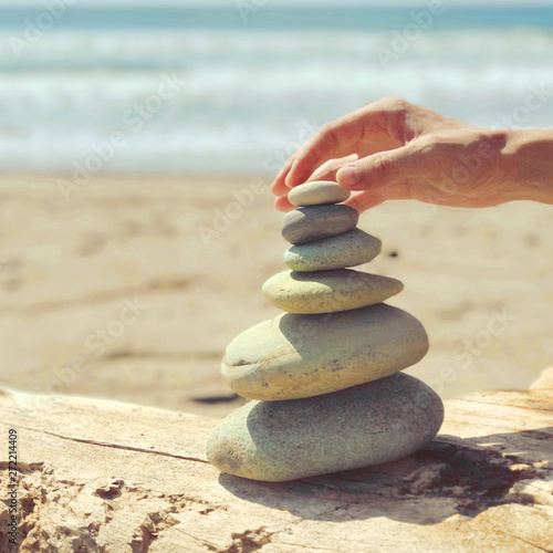 Zen stones on the sea summer beach.