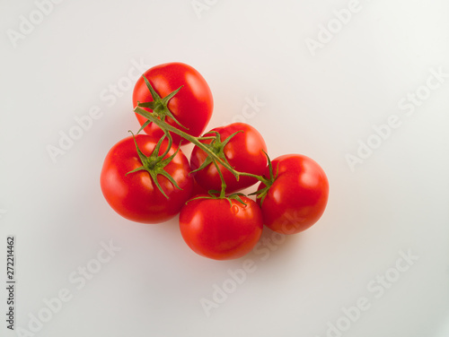 Red tomatoes fresh harvest on a white background © oleghz