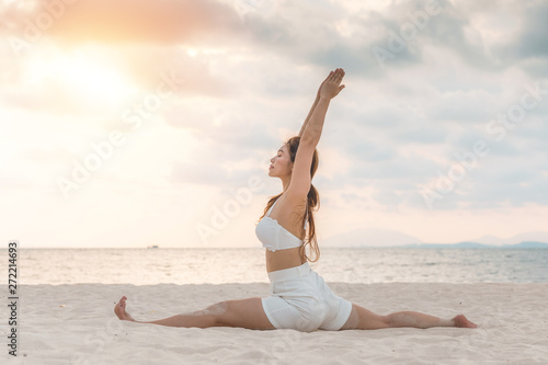 Photography Asian young woman practice Yoga Monkey God Pose or Yoga Hanumanasana pose on the