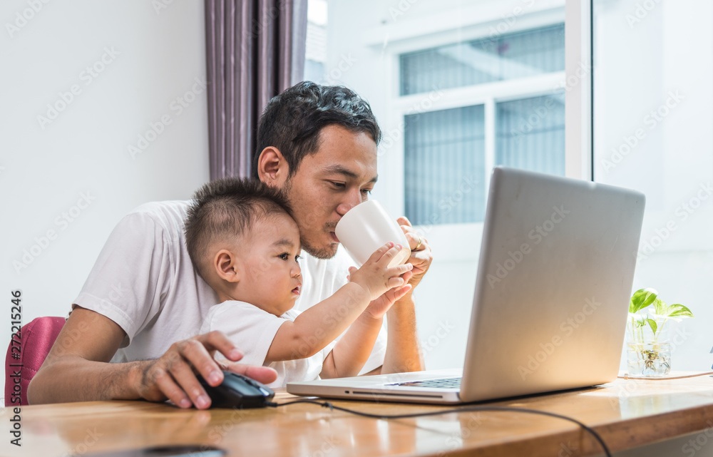 Man father using working on laptop computer Man father using working on laptop computer