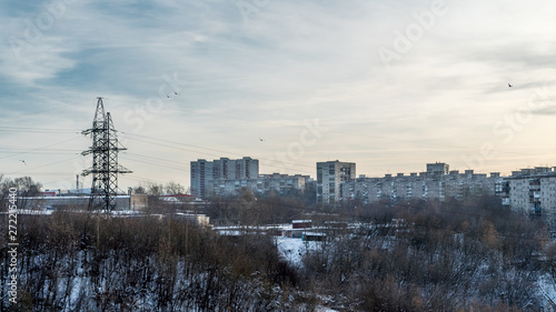 Before us is the outskirts of Perm, illuminated by the dim winter sun. We see a residential neighborhood adjacent to the supports of high-voltage power lines.
